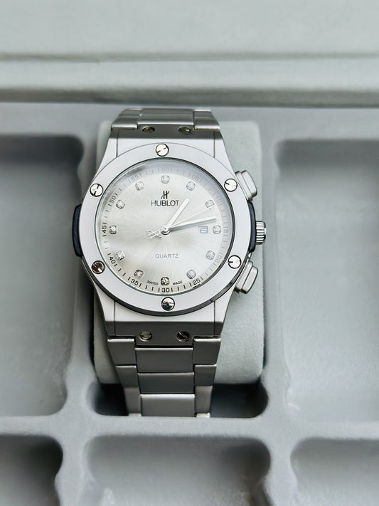 Silver Hublot watch on a gray background
